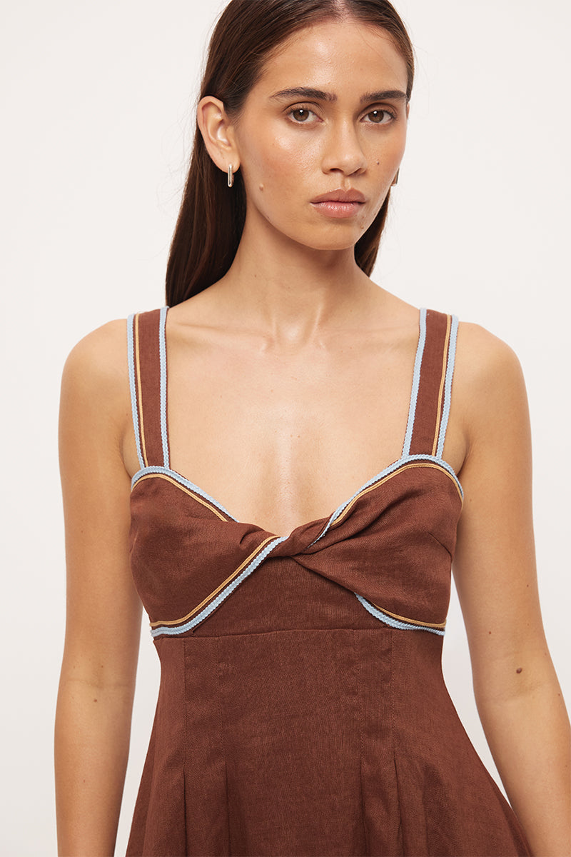 Twist front linen mini dress with sweetheart neckline, empire line fit and contrast cornelli applique