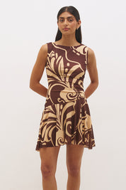 Sleeveless mesh mini dress with handcrafted print, boat neckline, fit and flare silhouette, and hi-lo hem