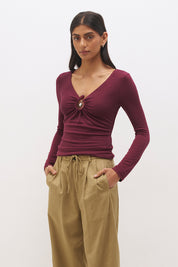 Long sleeve jersey top with plunging V neckline, spiral ring detail and ruched front in a skimming fit