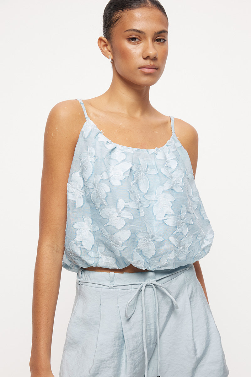 Cropped camisole top in semi-sheer floral applique with bubble hem and wide scooped neckline
