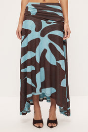 Mid-rise circle cut midi skirt in stretch mesh with asymmetrical gathered waistband and hi-lo hem in exclusive handcrafted print
