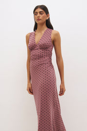 Sleeveless flocked polka dot mesh top with plunging V neckline, empire line seam and ruched fitted silhouette