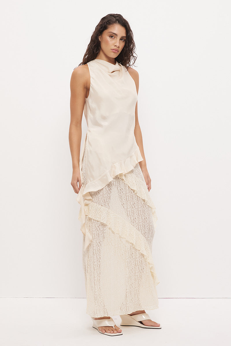 Sleeveless longline top in brushed cupro satin with narrow cowl neckline and asymmetric spiral flounce hem
