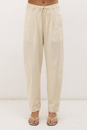Cotton twill barrel leg pants with mid-rise fit, drawstring waist and structured panel detailing