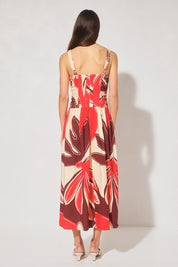 Handcrafted print strappy maxi dress with ruched bodice, dropped waist, gathered skirt, adjustable straps, and apron neckline
