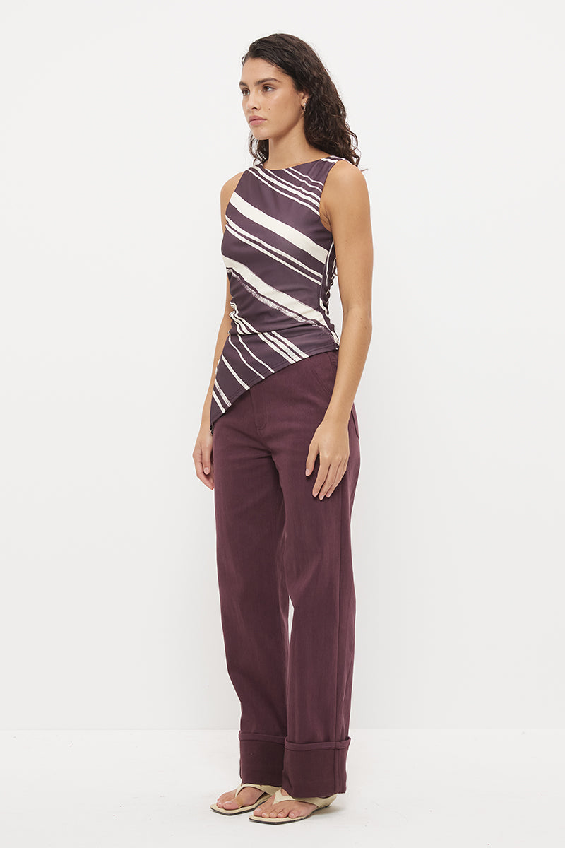 Sleeveless longline top with asymmetrical hemline, boat neckline and cascading waist ruching in exclusive handcrafted print