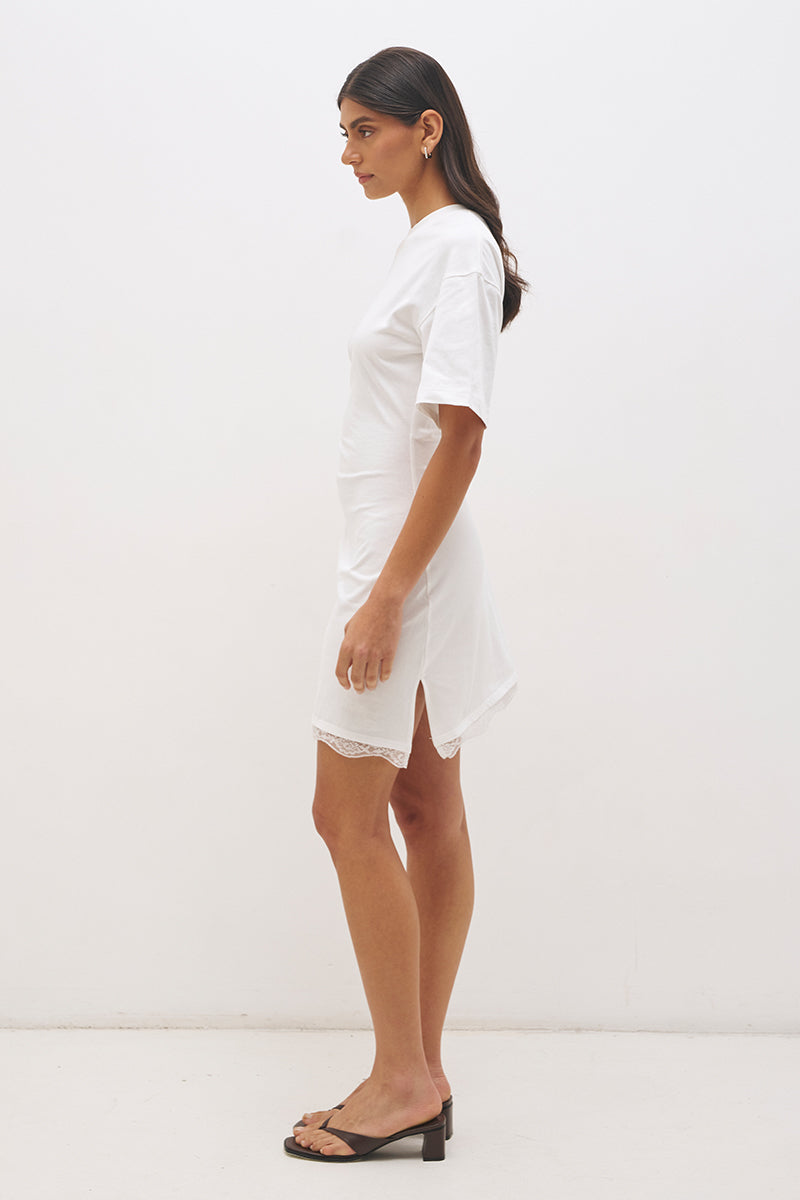 Cotton jersey tee mini dress with cinched waist, fitted skirt, side split and lace trim angled hem