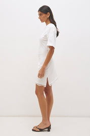 Cotton jersey tee mini dress with cinched waist, fitted skirt, side split and lace trim angled hem