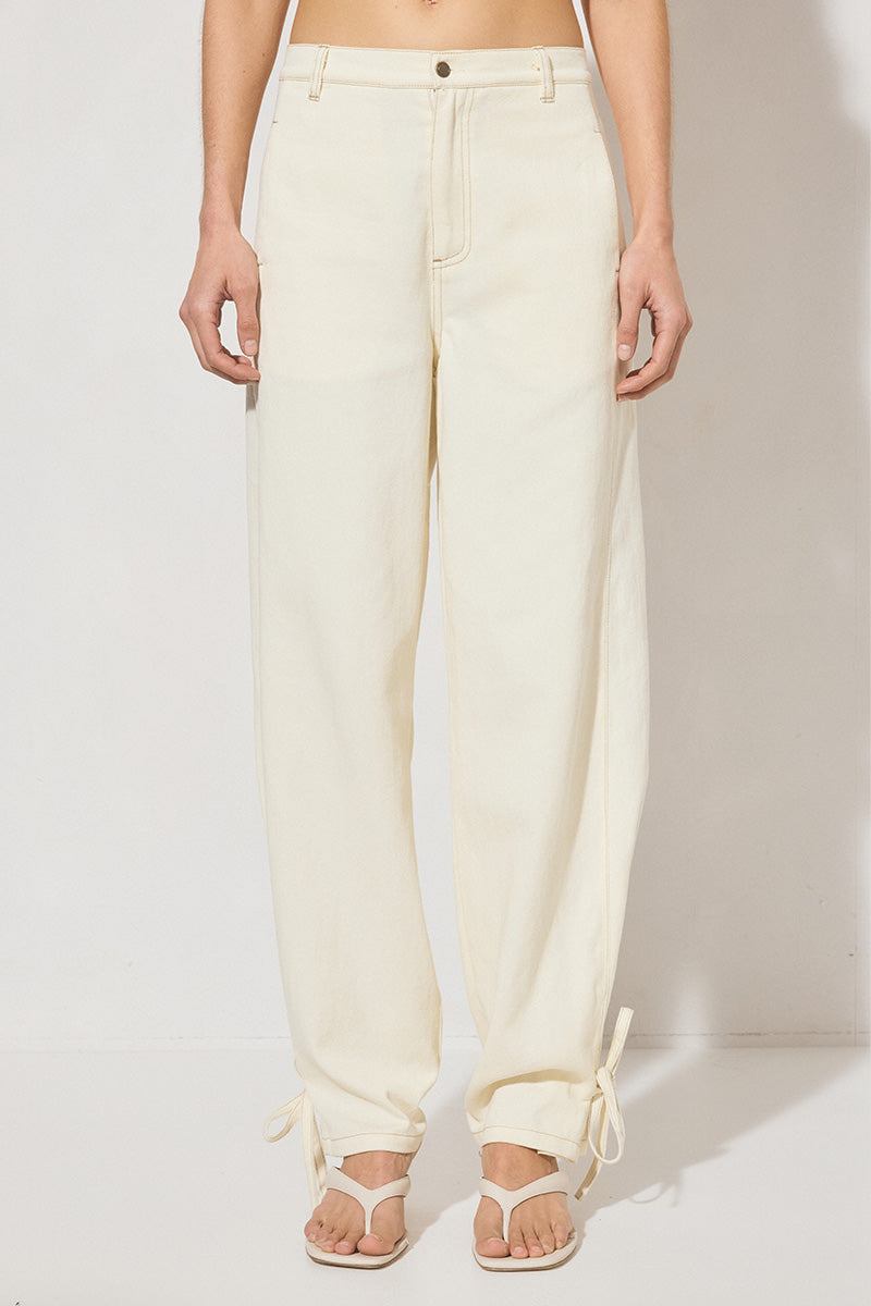 Hi-rise denim waisted pants with straight leg, side panel ties, back patch pockets, angled yoke, side seam pockets, and contrast topstitching