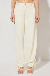 Hi-rise denim waisted pants with straight leg, side panel ties, back patch pockets, angled yoke, side seam pockets, and contrast topstitching
