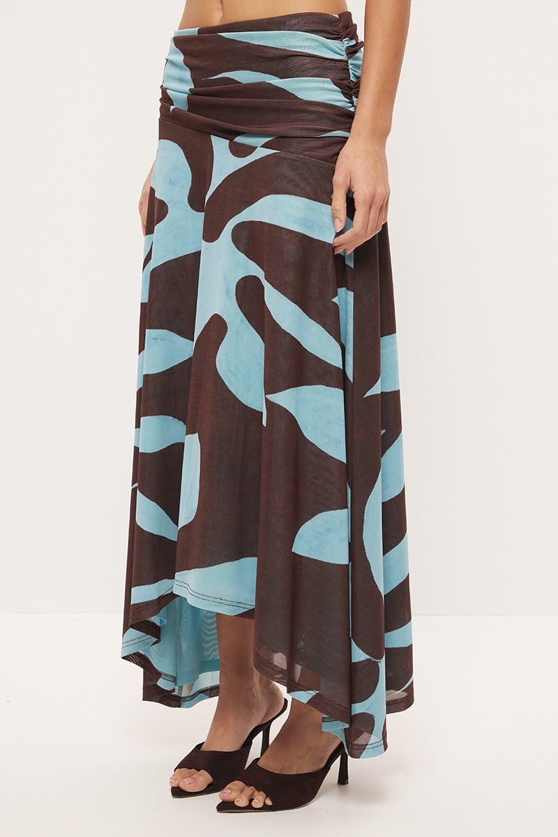 Mid-rise circle cut midi skirt in stretch mesh with asymmetrical gathered waistband and hi-lo hem in exclusive handcrafted print