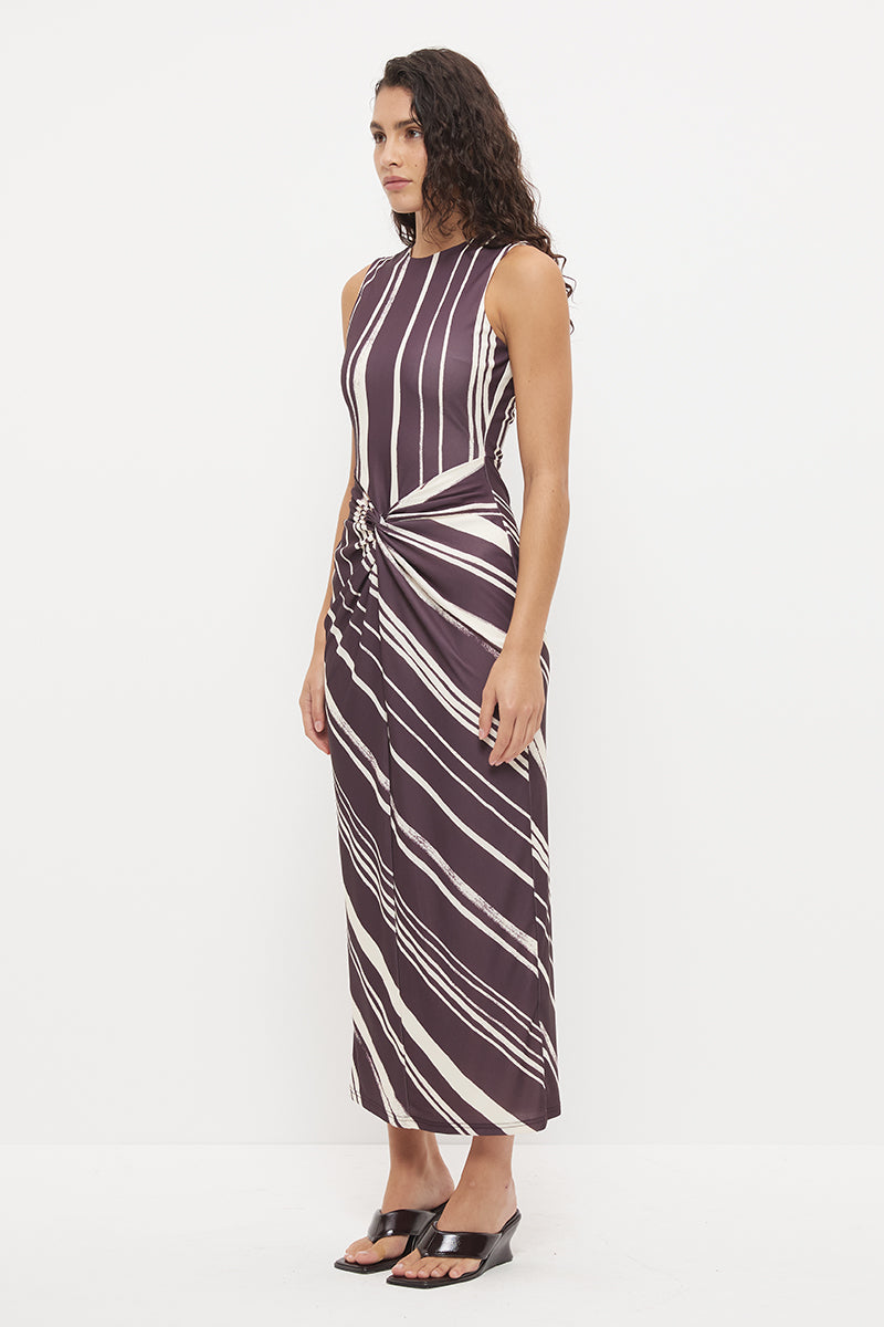 Sleeveless midi dress with fitted column silhouette, twisted knot detail and cascading ruching in exclusive handcrafted print