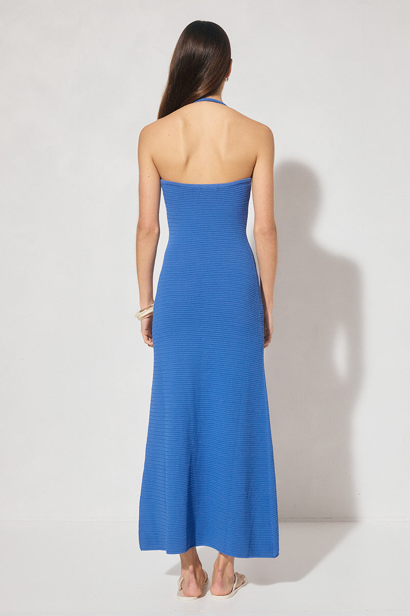 Knitted halter neck dress with asymmetrical cowled neckline, bodycon fit, contrast bead strap detail, and fit-and-flare silhouette