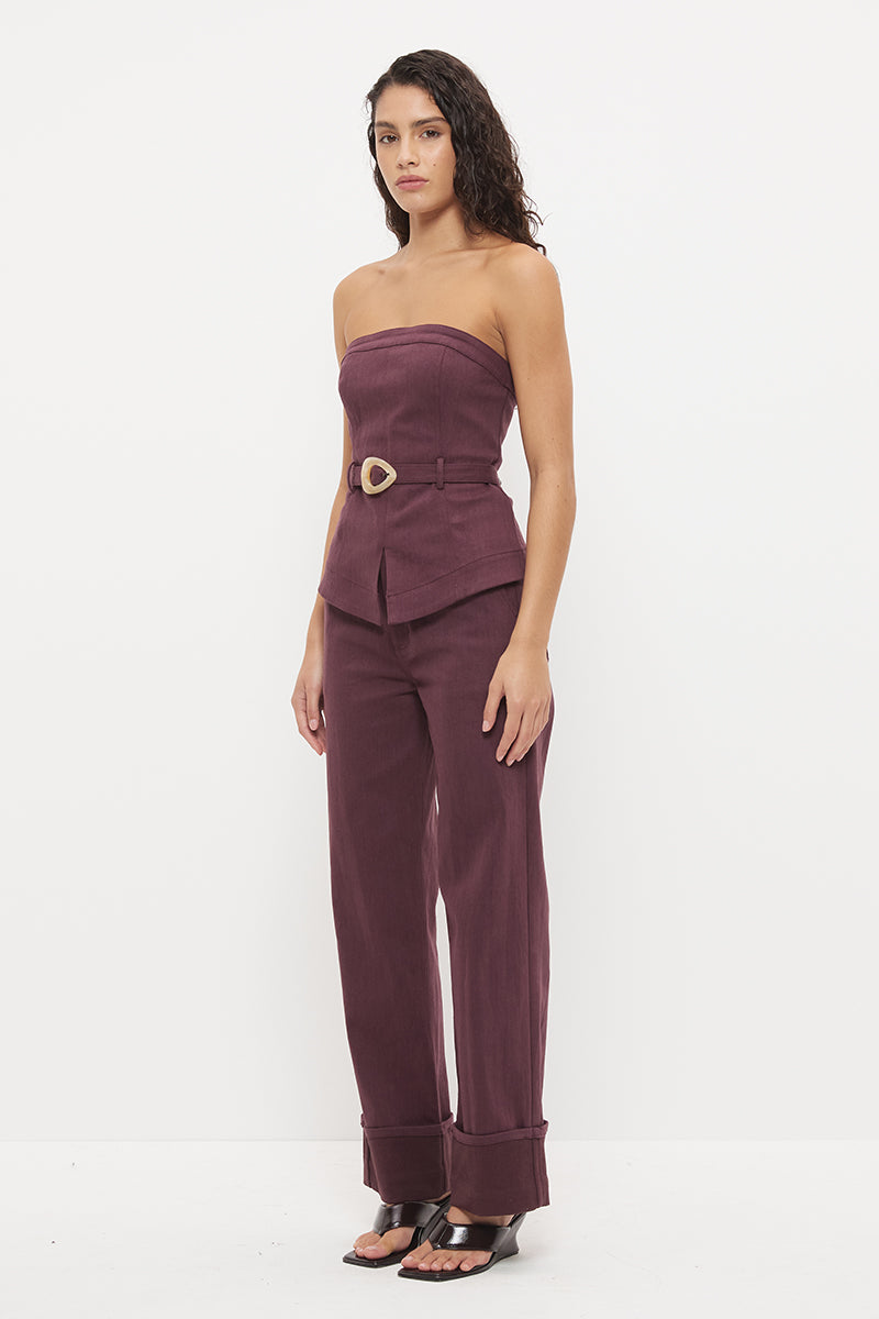 Strapless stretch denim top with tailored bodice, princess seams and contrast buckle belt