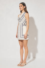 Sleeveless mini dress with handcrafted placement print, blouson bias-cut bodice, cowled neckline, and skimming mini skirt
