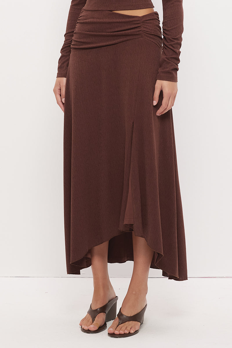 Printed asymmetrical midi skirt with gathered waistband, draped hi-lo hem, and front split in stretch modal jersey