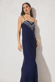 Bias cut maxi slip dress with handcrafted placement print, straight neckline, handkerchief front panel, and adjustable multiwear straps