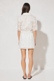 Semi-sheer embroidered mini shirt dress with V-neck notch collar, short sleeves, A-line skirt, and removable macramé waist belt