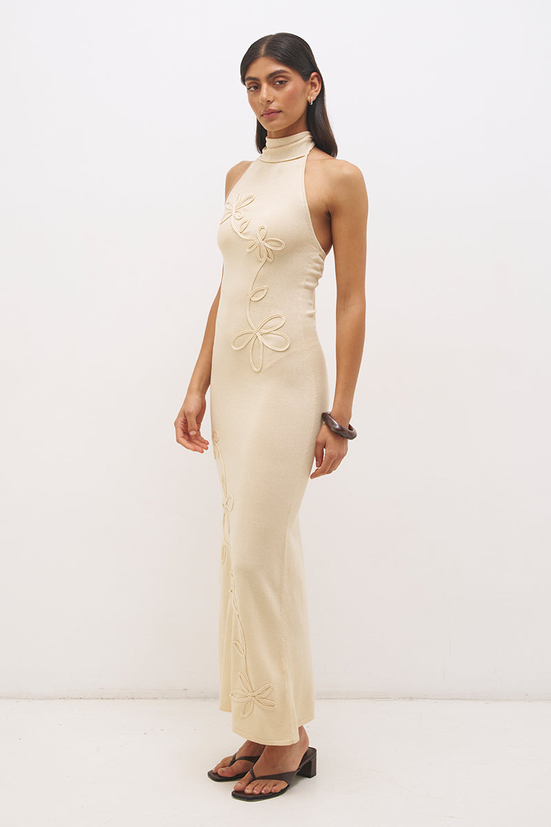 Knitted halter neck maxi dress with floral appliqué, turtleneck band, bodycon bodice and fit and flare skirt