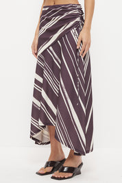 Mid-rise midi skirt with deep asymmetrical waist yoke, drawcord ruching and draped hi-lo hem in exclusive handcrafted print