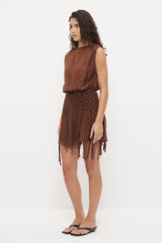 Sleeveless mini dress in sheer woven fabric with blouson bodice and tasseled scarf belt