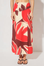 Maxi length cotton blend fit & flare skirt with draped asymmetrical waistband, angled tucks, side front split, and elasticated back panels