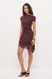Off-shoulder mini dress in stretch knit crepe with asymmetrical neckline and angled fringe hem detail