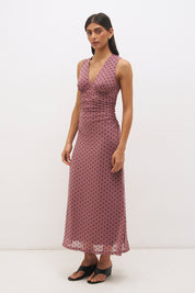 Sleeveless flocked polka dot mesh top with plunging V neckline, empire line seam and ruched fitted silhouette