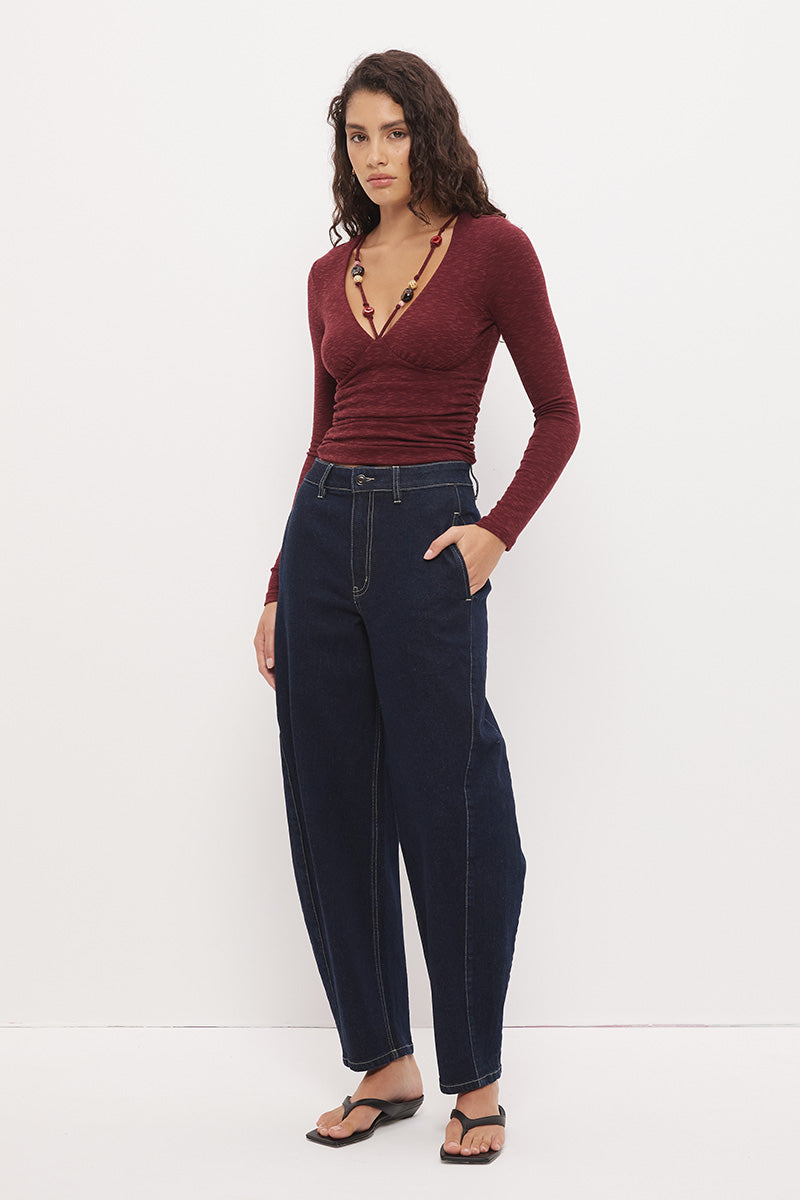 Long sleeve textured jersey fitted top with V-neckline, beaded strap detail, empire waist, and soft waist gathering