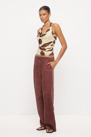 Fitted halter neck top in stretch mesh with asymmetrical draped cowl neckline in exclusive handcrafted print