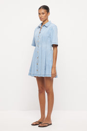 Light wash denim shirt mini dress with fit and flare silhouette, inverted pleats and contrast topstitching
