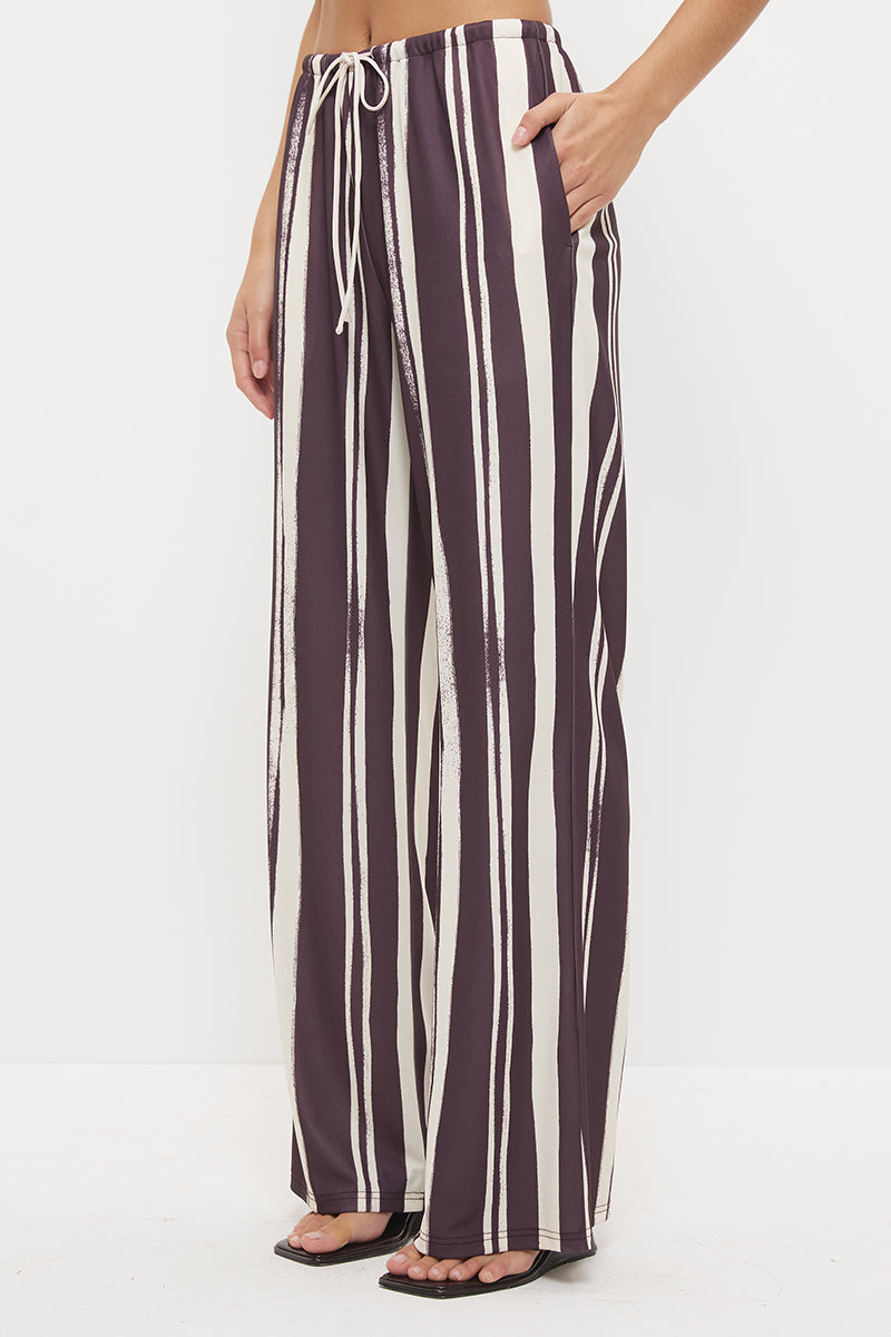 Mid-rise relaxed fit straight leg pants with drawcord waist in exclusive handcrafted print