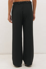 Woman wearing high-rise wide leg pants in a satin-backed linen blend with a tie-up belt featuring bead and ring detail.