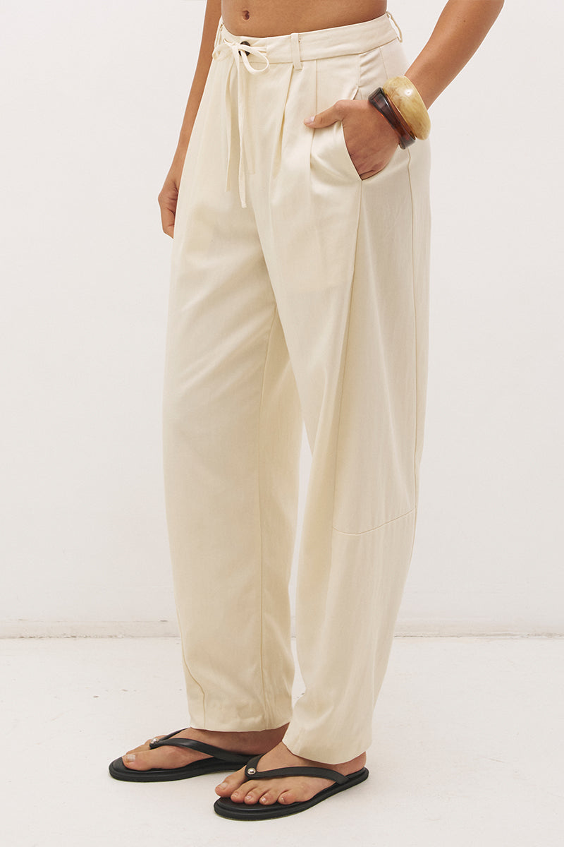 Cotton twill barrel leg pants with mid-rise fit, drawstring waist and structured panel detailing
