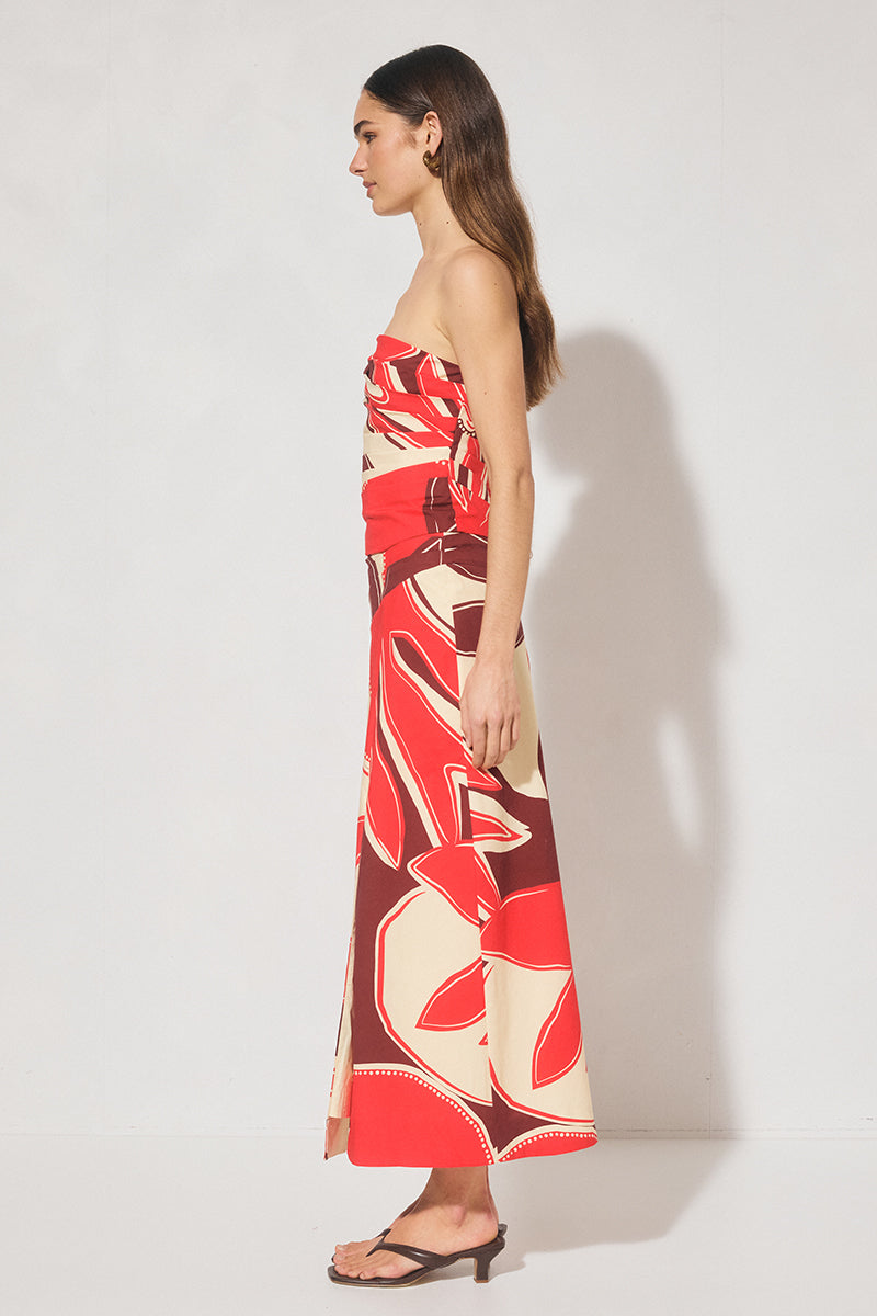 Strapless cotton blend bustier top with straight neckline, angled torso tucks, encased boning, elasticated back panels, and open-ended zipper