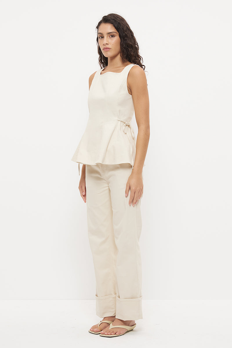 Sleeveless denim top with fit and flare silhouette, square neckline and circle cut flared hemline