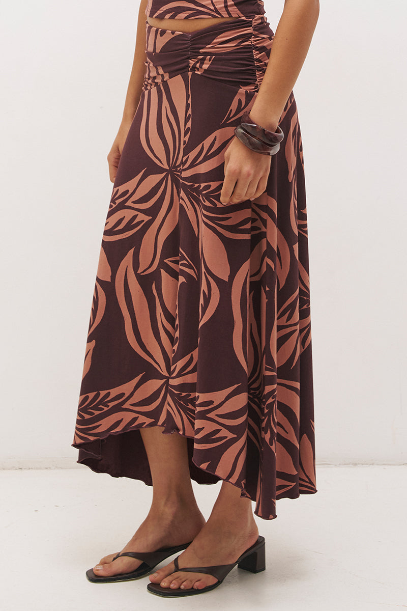 Printed asymmetrical midi skirt with gathered waistband, draped hi-lo hem, and front split in stretch modal jersey