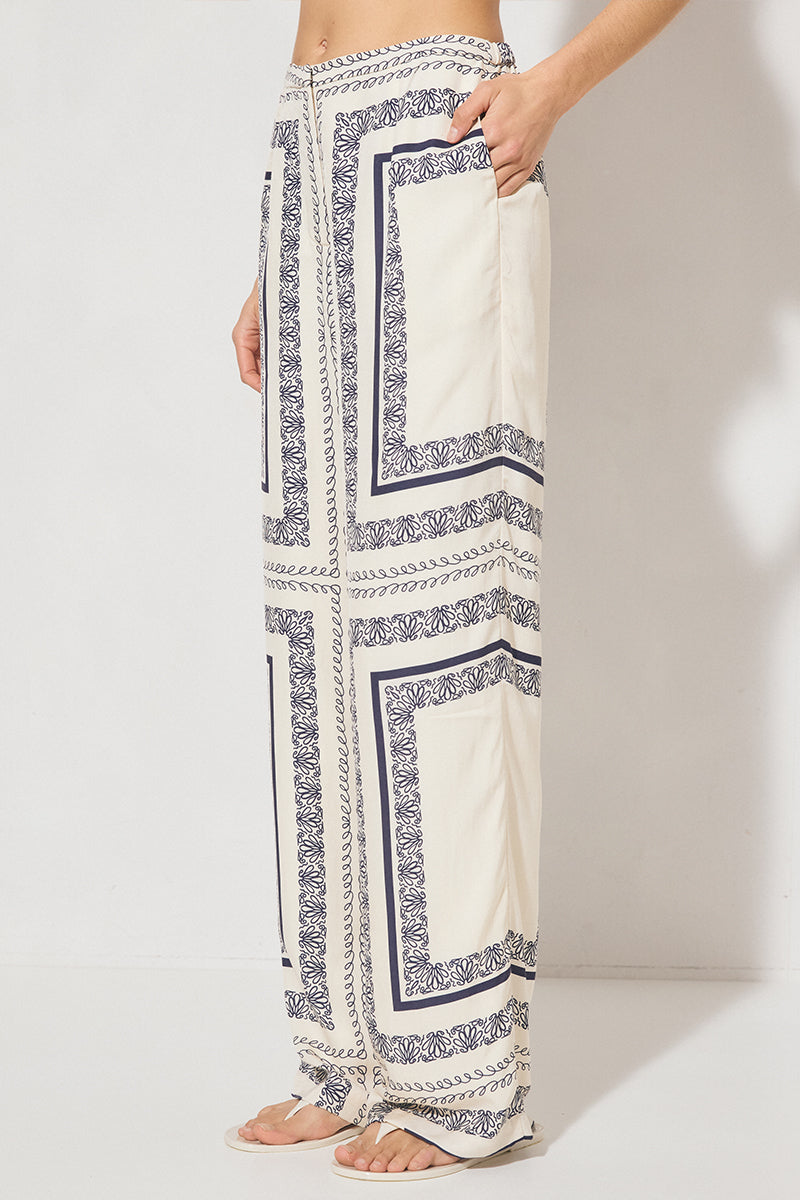 High-waisted tailored woven pants with handcrafted print, straight-leg silhouette, narrow waistband, and side seam pockets