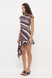 Cap sleeve mini dress with boat neckline, waist ruching and layered flounce hem in exclusive handcrafted print