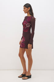 Long sleeve mesh mini dress with handcrafted placement print, boat neckline, sheer sleeves and fitted silhouette