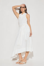 Sleeveless textured woven fit and flare midi dress with cowled neckline, ladder trim hem, handkerchief skirt, and waist sash