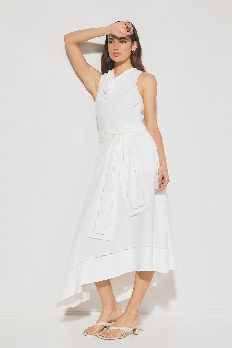 Sleeveless textured woven fit and flare midi dress with cowled neckline, ladder trim hem, handkerchief skirt, and waist sash