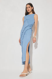 Sleeveless midi dress in textured jersey with skimming column silhouette, boat neckline, waist gathering, contrast frill panel detailing, and side seam split
