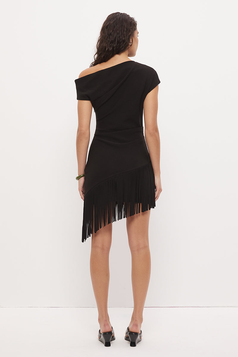 Off-shoulder mini dress in stretch knit crepe with asymmetrical neckline and angled fringe hem detail