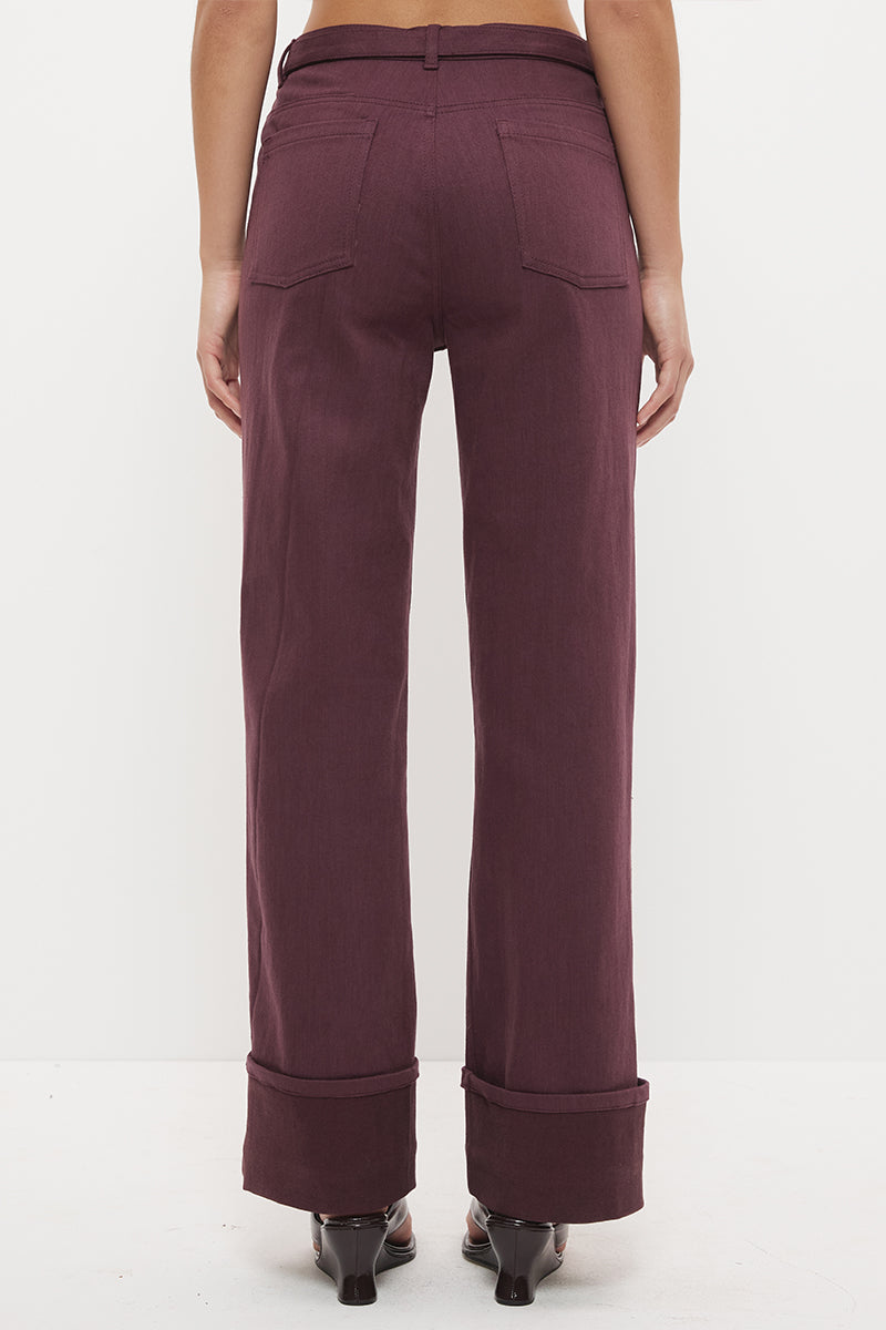 Mid-rise straight leg denim jeans with wide cuff hem and contrast buckle belt