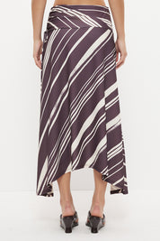 Mid-rise midi skirt with deep asymmetrical waist yoke, drawcord ruching and draped hi-lo hem in exclusive handcrafted print