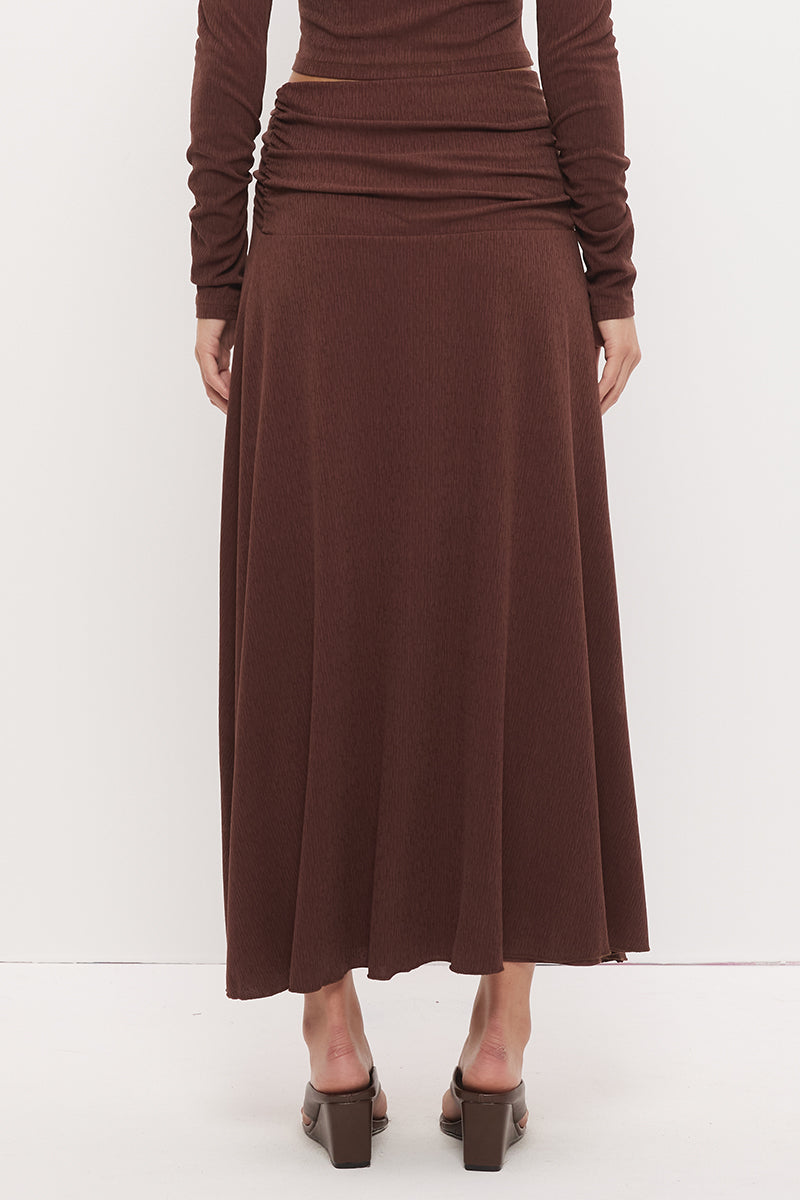 Printed asymmetrical midi skirt with gathered waistband, draped hi-lo hem, and front split in stretch modal jersey