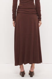 Printed asymmetrical midi skirt with gathered waistband, draped hi-lo hem, and front split in stretch modal jersey