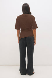 Cotton jersey tee with cinched waist, angled tuck detail, side splits and lace trim hem