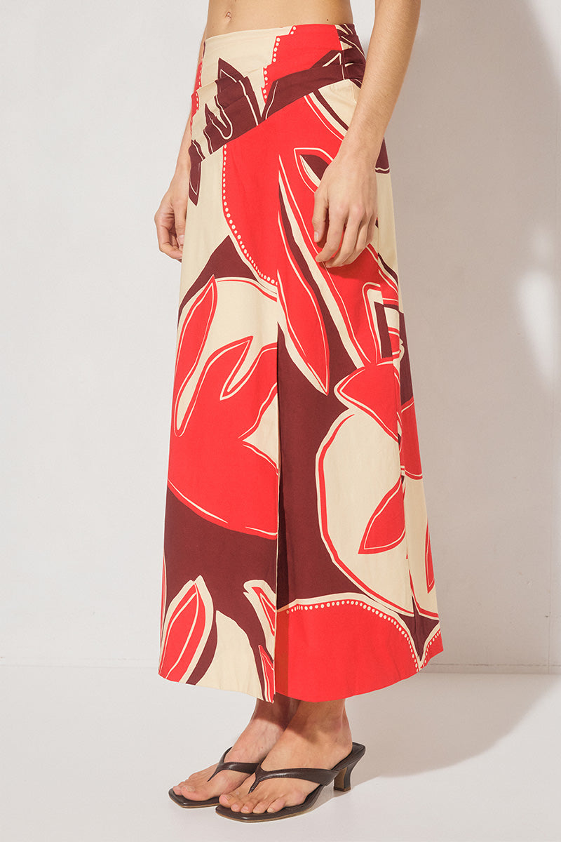 Maxi length cotton blend fit & flare skirt with draped asymmetrical waistband, angled tucks, side front split, and elasticated back panels
